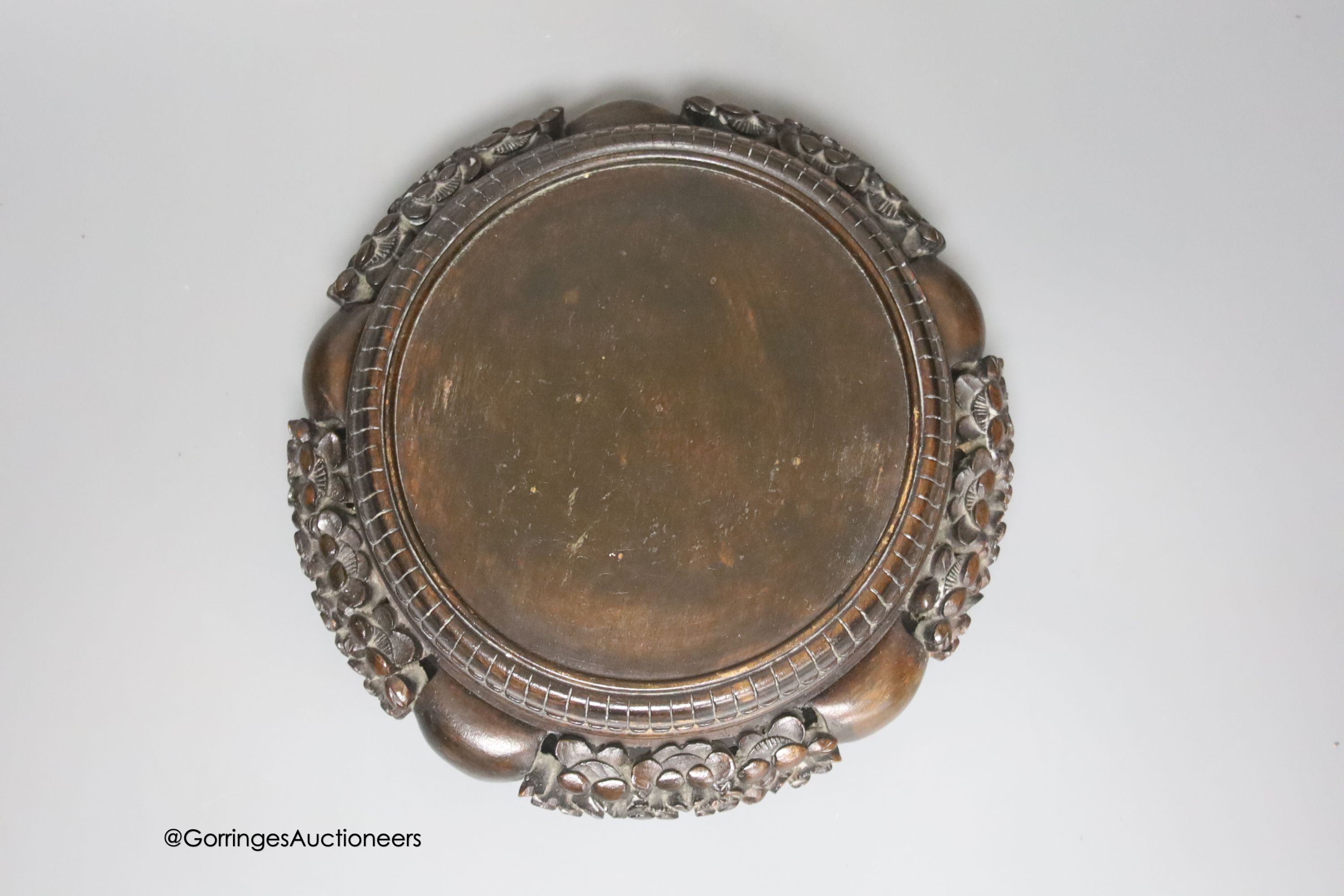 A Japanese carved and pierced hardwood stand, diameter 22cm